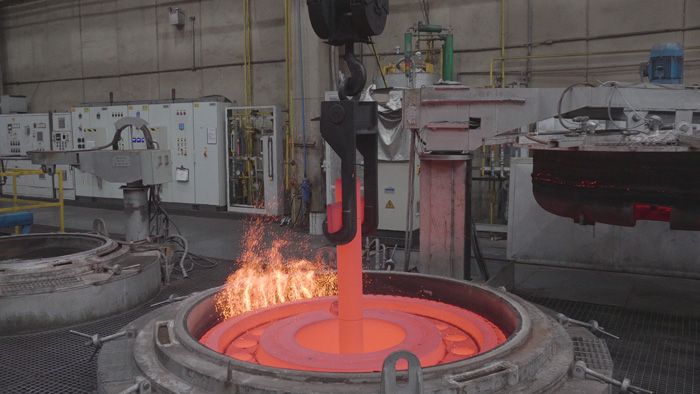 Large industrial heat treatment setup processing metallic components to enhance hardness, strength, and durability for heavy-duty applications.
