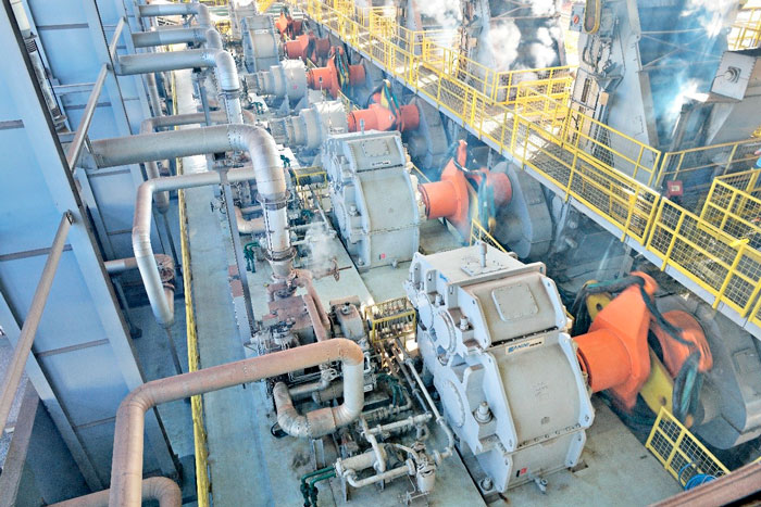 Close-up of an industrial speed reducer showing its housing and shaft, representing the core component of mechanical power transmission systems.