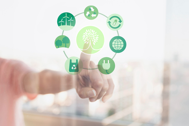 Business professional selecting sustainability icons, representing the ISO 14001 environmental management standard.