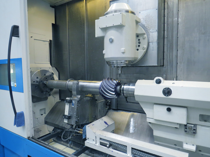 Modern CNC machine operating in a manufacturing plant, representing Industry 4.0 adoption in industry.