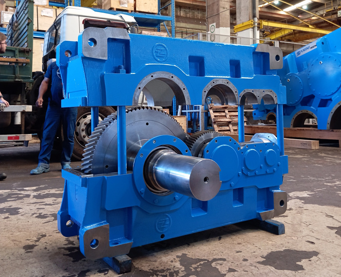 Zanini Renk speed reducer inside an industrial facility, connected to heavy machinery.